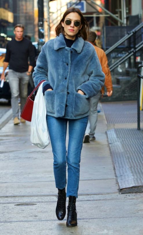 fur coat and jeans